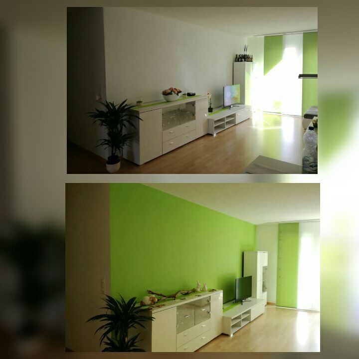 Wohnraum mit grüner Wand und weissen Möbeln